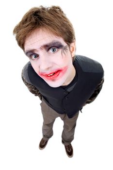 young man dressed as joker, isolated on white