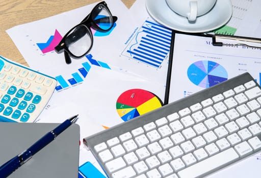 Business documents and keyboard placed on desks.