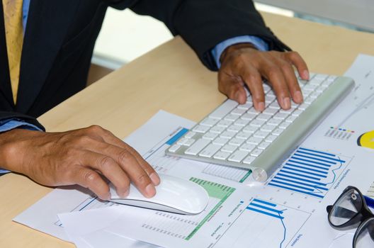 Business documents and keyboard placed on desks.