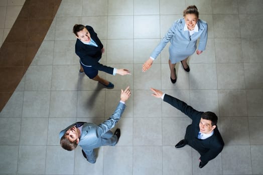 image of a businessman hands pointing to each other, looking at the camera