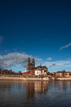 Magnificent Cathedral of Magdeburg at river Elbe with blue sky, Germany, 2014