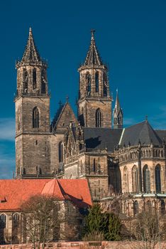 Magnificent Cathedral of Magdeburg at river Elbe with blue sky, Germany, 2014