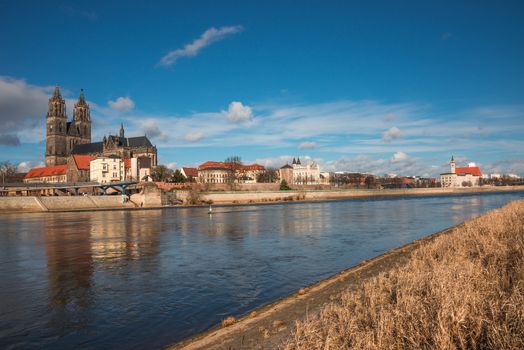 Magnificent Cathedral of Magdeburg at river Elbe with blue sky, Germany, 2014