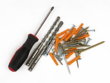 Screwdriver, drill and screws. Isolated on white background