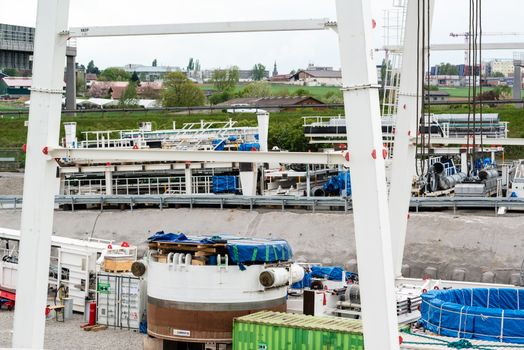 STUTTGART, GERMANY - April 20, 2014: Construction site of the Stuttgart21 (S21) railway project with huge tunnel drilling machinery by specialized company Herrenknecht on April 20, 2014 in Stuttgart, Germany. S21 is one of the most expensive and controversial railway projects ever with regular demonstrations against the plans to move the existing station underground going on.