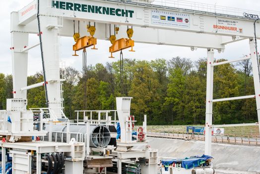 STUTTGART, GERMANY - April 20, 2014: Construction site of the Stuttgart21 (S21) railway project with huge tunnel drilling machinery by specialized company Herrenknecht on April 20, 2014 in Stuttgart, Germany. S21 is one of the most expensive and controversial railway projects ever with regular demonstrations against the plans to move the existing station underground going on.