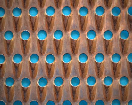 Abstract background of old perforated metal grater