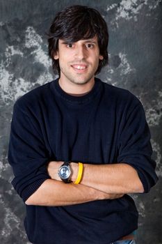 young casual man portrait on a dark background