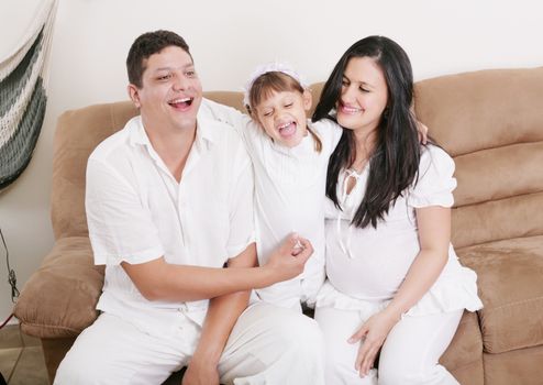 Happy American Family Playing with daughter in the living room