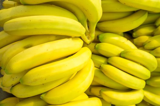 Full frame take of fresh bananas on a market stall