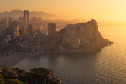 A foggy early morning casting its light on Benidorm skyline