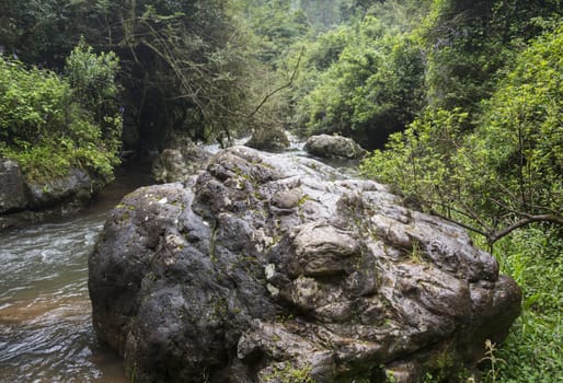 big rock in  river from the waterfall near Sabie south Africa in hazyview area