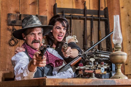 A Shouting Cowboy and Saloon Girl Point Their Weapons at You