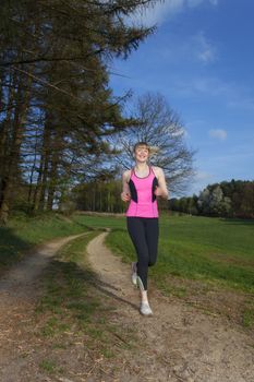 young woman jogging with motion blur