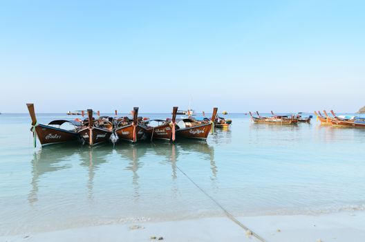 April 24, Lipe Island, Trang/Thailand: Logtail boats are waiting for tourists for go snorkeling and diving.