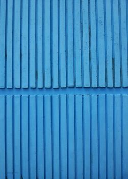 Striped blue wall texture pattern.