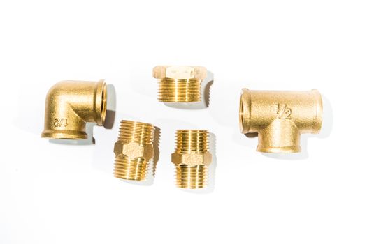 Joints, brass faucet on white.