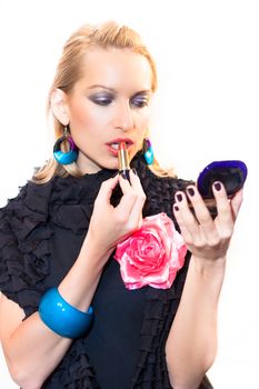 Young beautiful woman applying fashionable colorful party make-up.