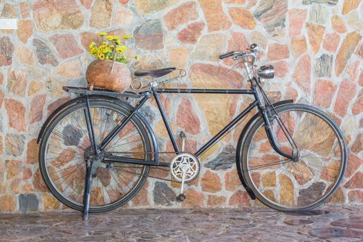 Antique bicycle with flowers.