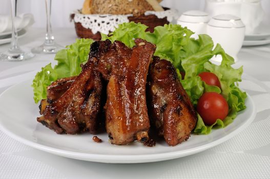 Pork ribs in honey and soy sauce with garlic