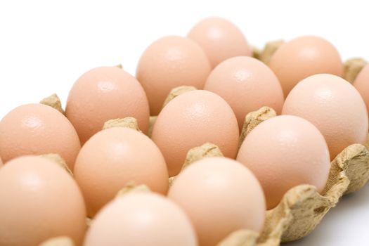 Dozen eggs isolated on white background