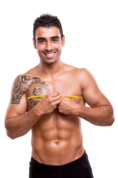 Fitness man measuring his body over white background