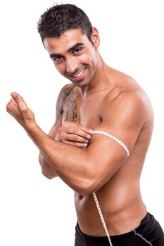 Fitness man measuring his body over white background