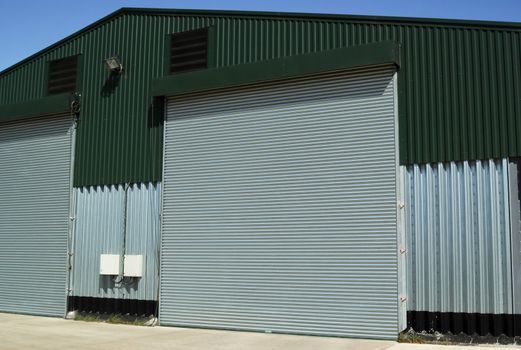 large shutter doors of a modern industrial warehouse