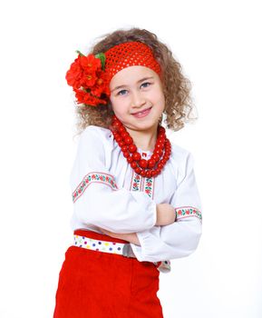 A little girl in Ukrainian national dress on the white background