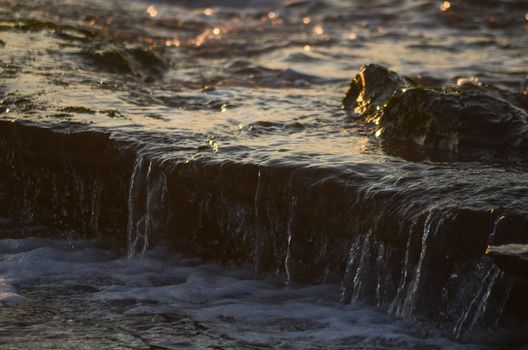 Beach, water under sunset scene in portugal