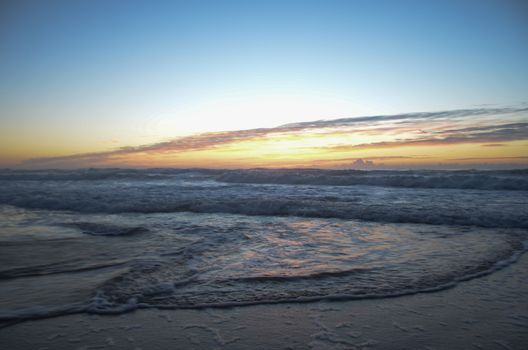 Beach, water under sunset scene in portugal