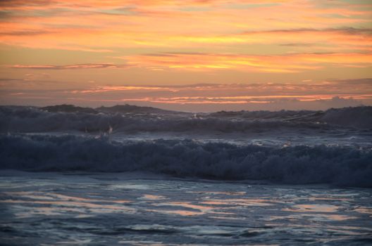 Beach, water under sunset scene in portugal