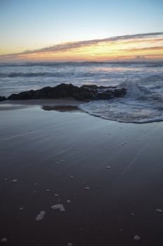 Beach, water under sunset scene in portugal