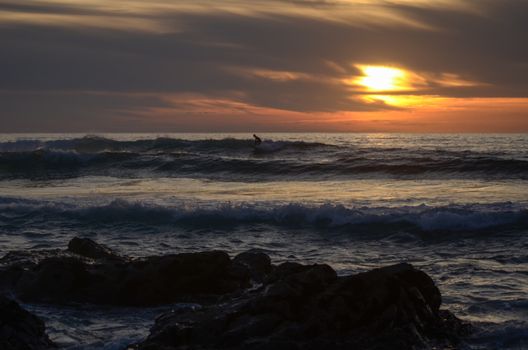 Beach, water under sunset scene in portugal