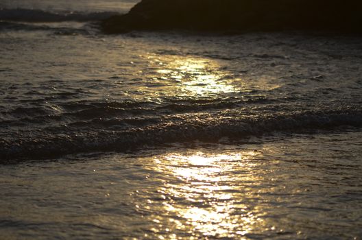 Beach, water under sunset scene in portugal