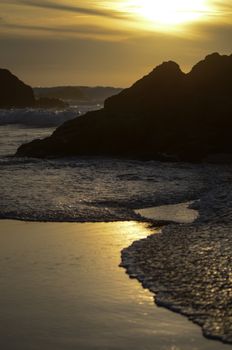 Beach, water under sunset scene in portugal