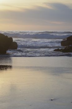 Beach, water under sunset scene in portugal