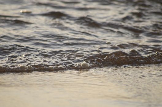 Beach, water under sunset scene in portugal