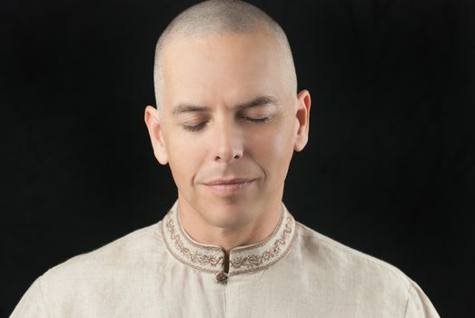 Close-up of a buddhist meditating.