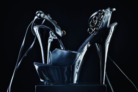 Elegant black patent-leather shoes, on high heels