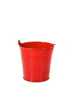 small red bucket on white scene,shallow focus