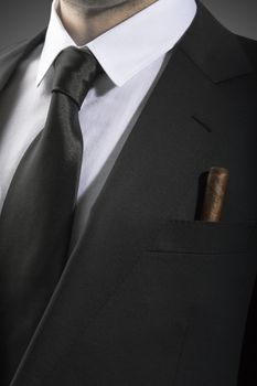 Jacket and tie with cuban cigar in the pocket, Italian fashion concept