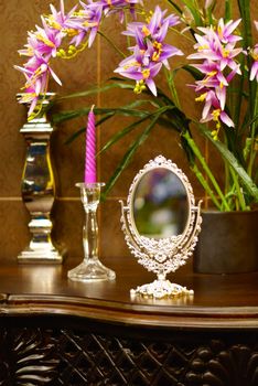 baroque style mirror on wood table,shallow focus