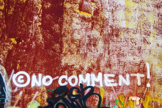 No comment - graffiti inscription on the dirty wall