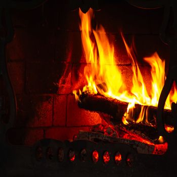 Flames of bonfire in fireplace