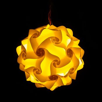 Yellow street lamp on black background