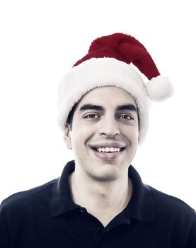 Portrait of happy smiling young man with santa's hat against white background