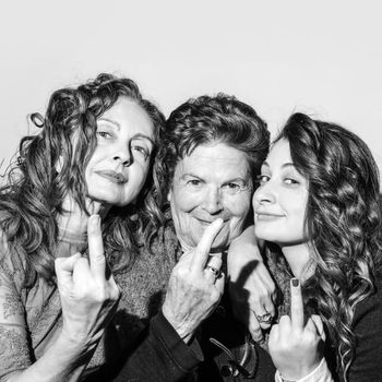 Three women with the middle finger send someone to hell