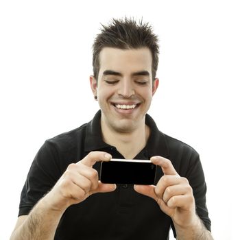 Happy young man looking at his smartphone