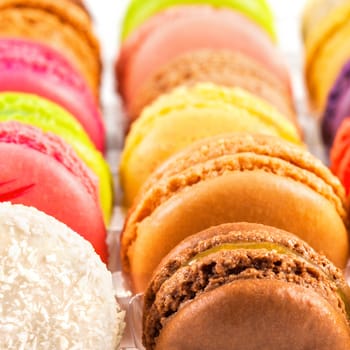 traditional french colorful macarons in a rows in a box